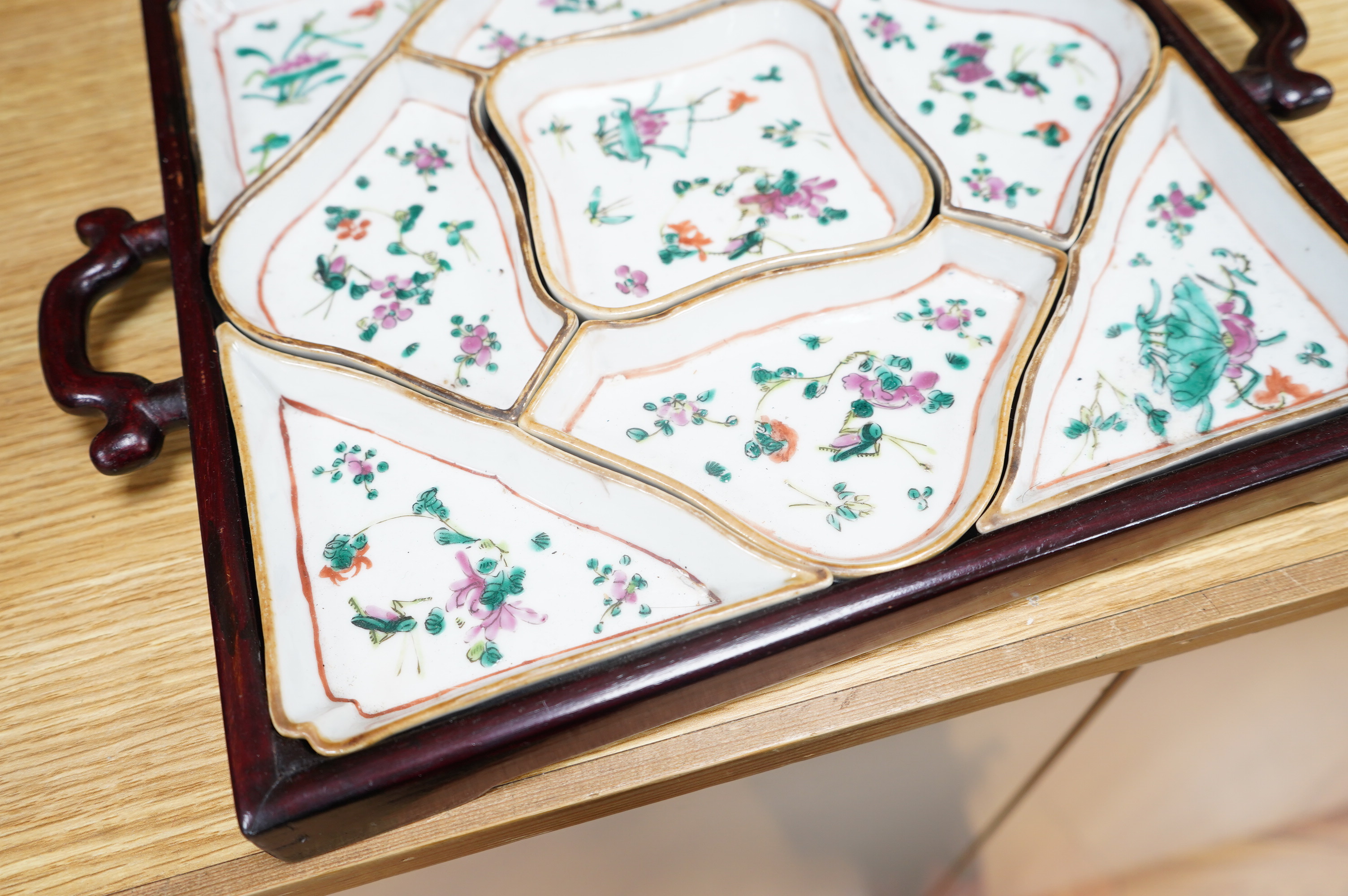 A square Chinese hardwood tray of famille rose geometric dishes, 30cm. Condition - fair to good